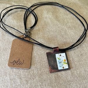 Handmade one of a kind copper torch fired enamel pendant on leather necklace.